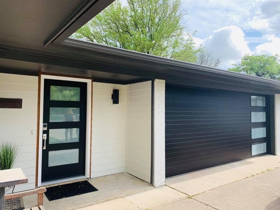 clopay black modern steel garage door with frosted glass