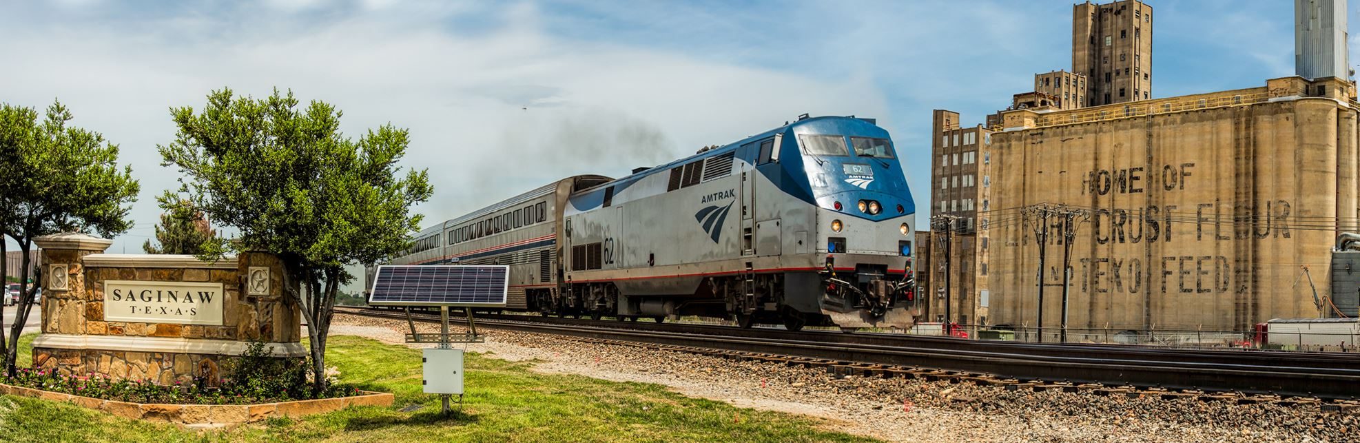 Saginaw Texas railroad track with Amtrak train going across