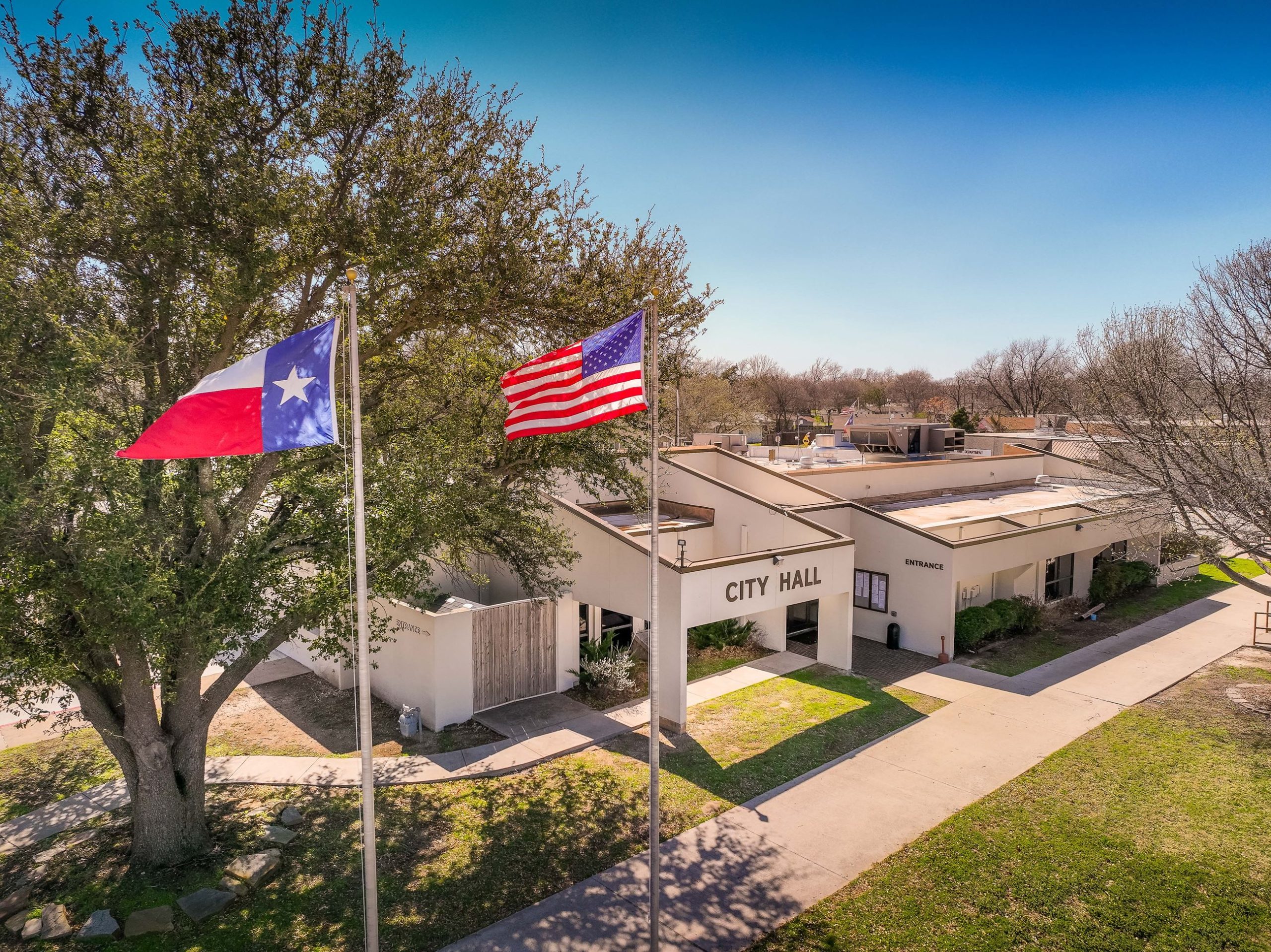 city hall in White Settlement, Texas with two flags raised