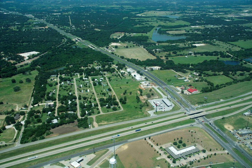 overview of Alvarado, Texas surrounded by various roads, trees, and fields