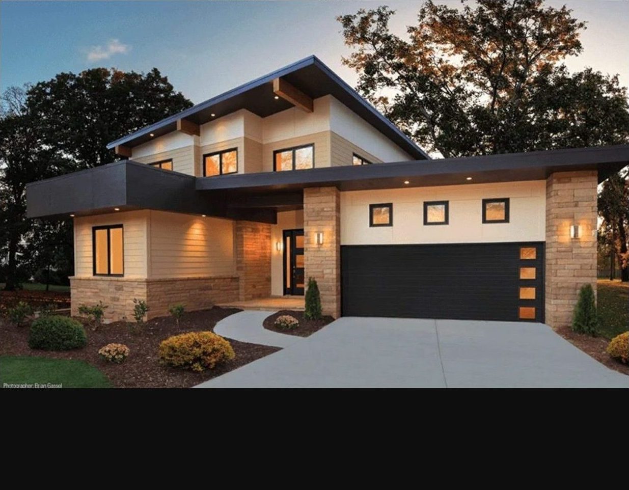 modern style house with half white half brown garage door that has four vertical windows and three horizontal windows