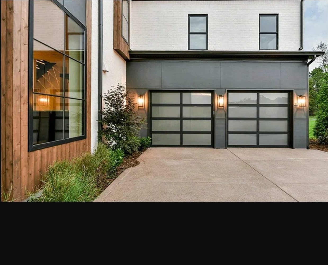modern home with avante glass door garage